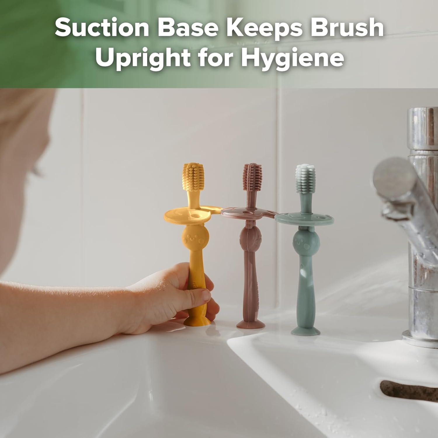 image:imagehaakaa 360 Baby Toothbrush with Suction Base Gentle Cleaning for Infant SelfBrushing Training FoodGrade Silicone Adjustable Safety Shield Pea Green 1 PieceMustard